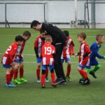 children playing soccer